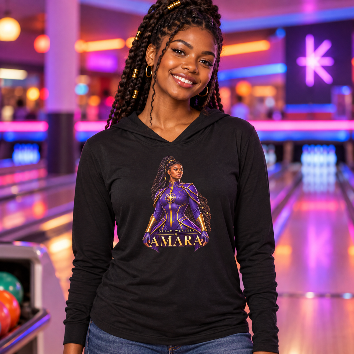 Young woman wearing the black Amara Dream Weavers lightweight hoodie at a neon bowling alley