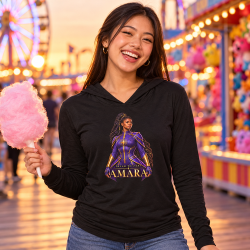 Young woman laughing in the black Amara Dream Weavers lightweight hoodie on an amusement park boardwalk