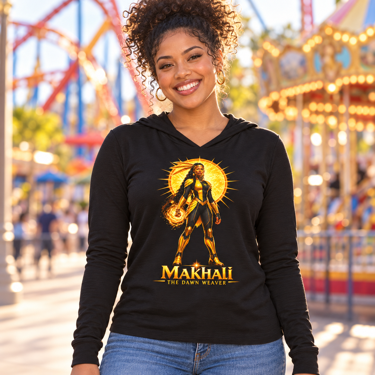 Young woman smiling in the black Makhali Dream Weavers lightweight hoodie at a theme park