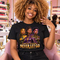 Never Let Go Dream Weavers trio graphic tee in black, worn at a nail salon